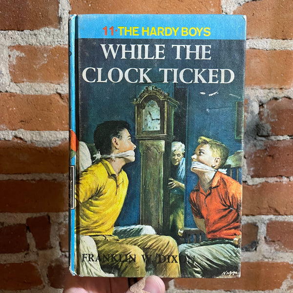 While the Clock Ticked: The Hardy Boys #11 - Franklin W. Dixon - 1962 Hardback