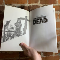 The Walking Dead Vol. 1: Days Gone Bye & Vol. 02: Miles Behind Us- Robert Kirkman, Tony Moore, Charlie Adlard, & Cliff Rathburn